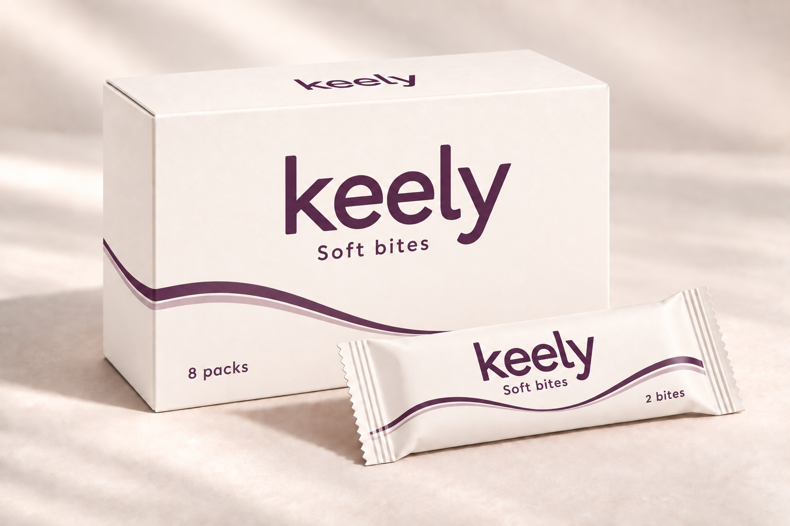 keely Soft bites packaging concept: ivory eight-pack carton and sealed wrapper with purple lettering and subtle purple curves